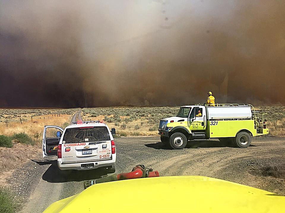 Smoke blackens the sky during the weekend's Black Rock fire near Wilson Creek.