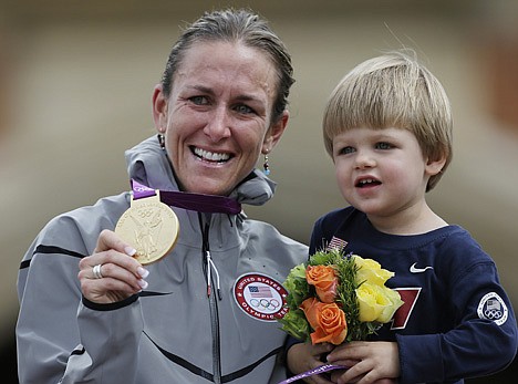 &lt;p&gt;Gold medalist Kristin Armstrong, of the United States, celebrates with her son, Lucas, after winning the women's individual time trial event at the 2012 Summer Olympics, Wednesday, Aug. 1, 2012, in London. (AP Photo/Matt Rourke)&lt;/p&gt;