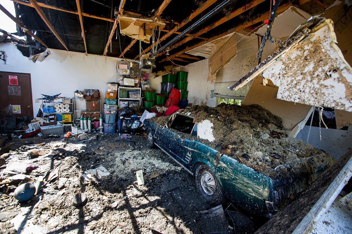 &lt;p&gt;A 1966 Ford Mustang sits in a partially burnt-out garage of a home that burned down Sunday evening. The car is a Evensizer family heirloom.&lt;/p&gt;