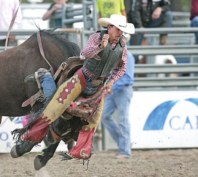 &lt;p&gt;Gerald Eash of Fortine takes the saddle with him as he exits &quot;Open Market&quot; during Saturday night's edition of the Kootenai River Rodeo. (Paul Sievers/ The Western News)&lt;/p&gt;