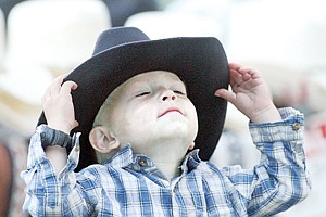 &lt;p&gt;Two-year-old Kypton Vincent trying on cowboy hats Saturday night at the rodeo.&lt;/p&gt;