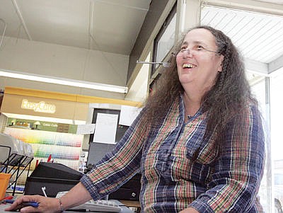 &lt;p&gt;Cardinal Hardware's Sheri Brookshire converses with customers Thursday morning. (Paul Sievers/The Western News)&lt;/p&gt;