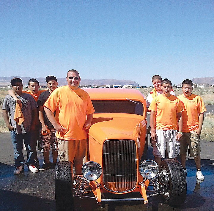 At last year's Hot Desert Nights, members of the Wahluke High School Auto Detailing and program director Jay Scott, Gus Mendez, Diego Arreguin and Carlos Cruz pose with a 1932 Ford Low Boy which ran in the drag races.