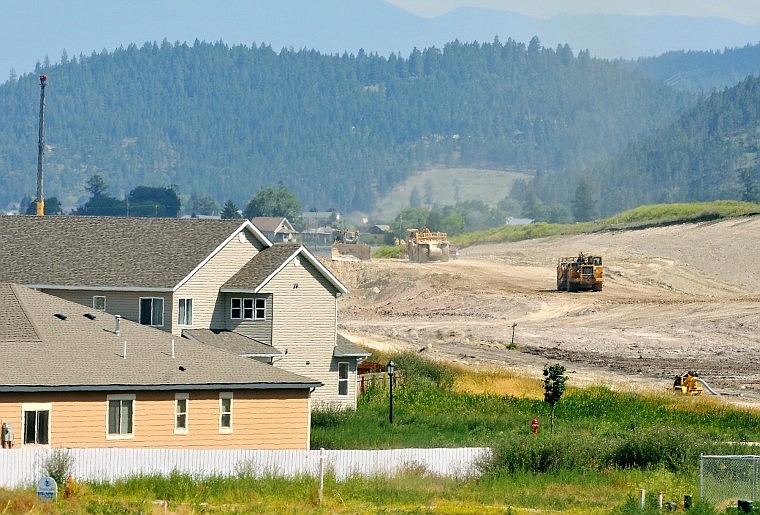 Ames Construction crews work on the south portion of the US 93 Bypass between Airport Road and US 2 Thursday afternoon. According to Montana Department of Transportation Construction Engineer Ed Toavs, the section is more than 50 percent complete.