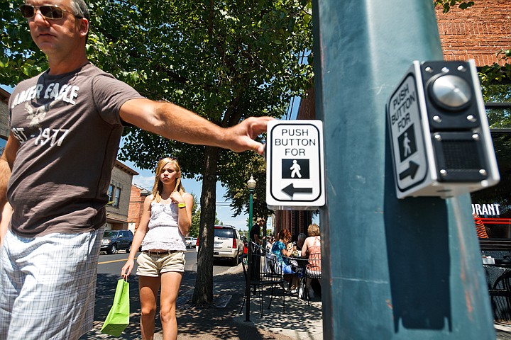 &lt;p&gt;SHAWN GUST/Press Makayla Hoey, of Vancouver Island, 12, looks on as her father Bill pushes the crosswalk button at the corner of Fifth Street and Sherman Avenue Tuesday in Coeur d'Alene. The recently installed audible crosswalk alert has drawn some complaints from area residents.&lt;/p&gt;