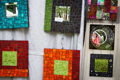 &lt;p&gt;&#160;Sommer Bright, 12, is reflected in a mosaic mirror in a booth at the 45th annual Art on the Green on the North Idaho Campus.&lt;/p&gt;