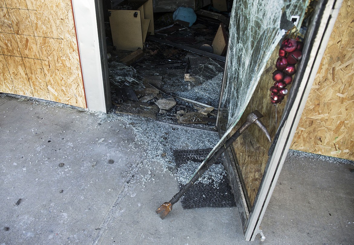 &lt;p&gt;Broken glass is seen scattered around the entrance of the Good Samaritan Rehabilitation Thrift Store Thursday morning.&lt;/p&gt;