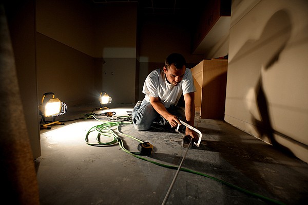 <p>Jeremiah Brown of Precision Cut Flooring in Bigfork works in the new surgery tower on Wednesday, August 1, at the Kalispell Regional Medical Center.</p>