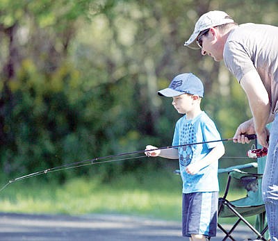 &lt;p&gt;A little father and son fishing time with Noah Brothers, left, and Kenney Brothers Saturday at the kids' fishing pond.&lt;/p&gt;