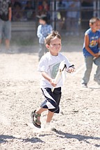 Five-year-old Zoran Lafrombois, of St. Ignatius, takes off during the stickhorse racing last Saturday.