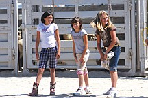 Suzanah Clark, left, Kalista Clark and Tyla Castor prepare at the starting line during the kids sheep dressing competition.