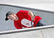 Travis Rushing, of Polson, leans into the wall during SkateJam last weekend in Polson.