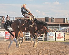 Troy Ruhkala, of St. Ignatius, holds on during a run at the Pioneer Days rodeo last weekend in Ronan.