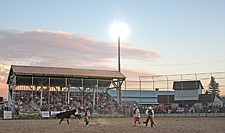 Day turns into dusk during the Pioneer Days rodeo last weekend in Ronan.