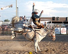 Troy Ruhkala, of St. Ignatius, gets bucked from his horse during Pioneer Days last weekend in Ronan.