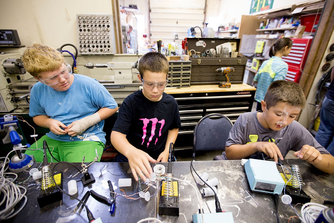 &lt;p&gt;From left to right, Jayden Currey, 13, Gavin Ruddell, 11, and Matthew Moler, 11, solder together electric motors on Thursday at Gizmo in Coeur d'Alene. As part of the Gizmo2xtreme program, the motors will be used on robots designed by kids in the program to gather data from various lakes in North Idaho.&lt;/p&gt;