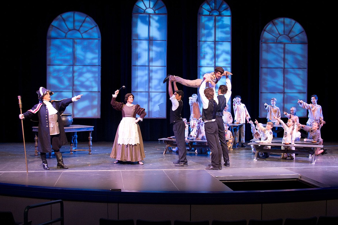 &lt;p&gt;Cast members of Spokane Valley Summer Theatre's production of &quot;Oliver!&quot; lift Hudson Drake, 10, of Post Falls, into the air. Hudson's big role as Oliver is also his acting debut.&lt;/p&gt;