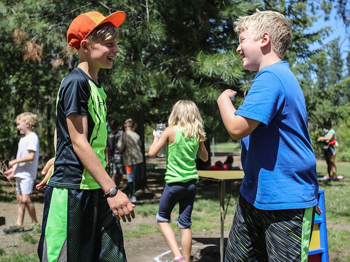 &lt;p&gt;Logan Bletther, 10, of Post Falls and Payton Conn, 9, of Hayden, laugh with each other at Kamp Ka-Mee-Lin. The camp is held at Kiwanis Park in Post Falls and runs from 7a.m. to 6p.m. Monday through Friday. The camp currently has more than a hundred members from ages 4-13 years of age.&lt;/p&gt;