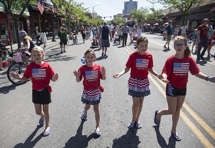 &lt;p&gt;LOREN BENOIT/Press From left to right, cousins Madeline Turner, 8, Taylor Floyd, 8, Mackenzie Turner, 10 and Cameron Floyd, 10, perform a cheer as they walk down Sherman Avenue during Coeur d'Alene's Kids Parade. This years parade theme was Wide World of Sports.&lt;/p&gt;