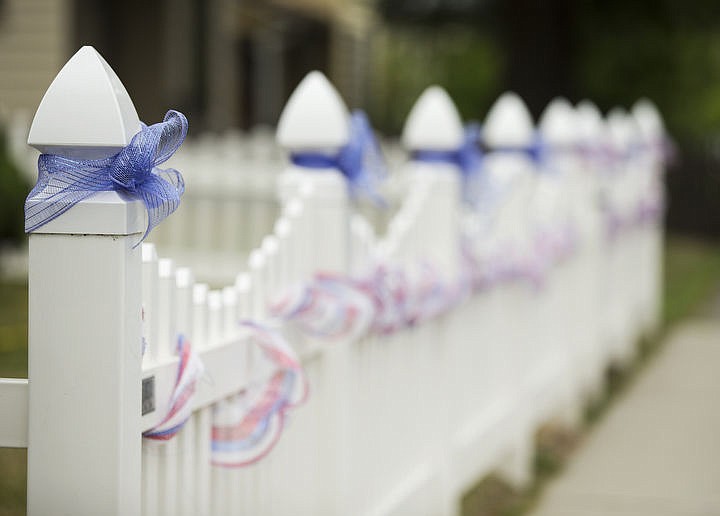 &lt;p&gt;LOREN BENOIT/Press Braided red, white and blue ribbons are seen on the front yard fence of a house on 7th street in downtown Coeur d'Alene prior to the Fourth of July.&lt;/p&gt;