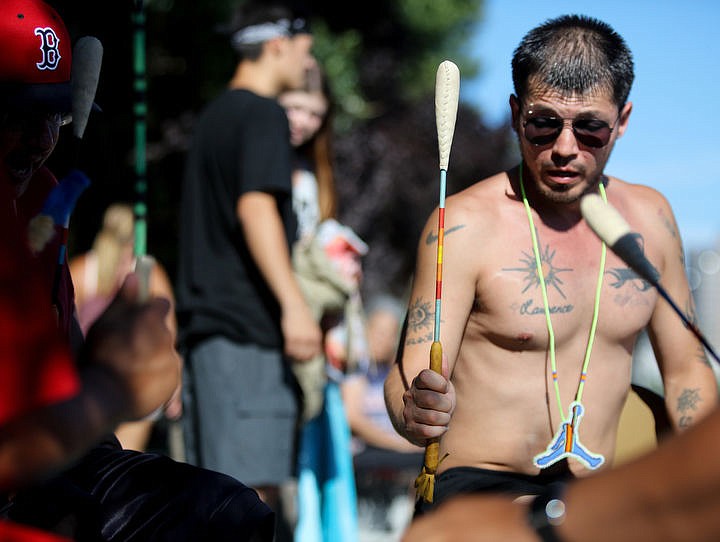 &lt;p&gt;Ray Finley, 36, of Kalispel Tribe, plays drums as the Tribes from all over the region canoe towards the beach on Lake Coeur d'Alene, Thursday.&lt;/p&gt;