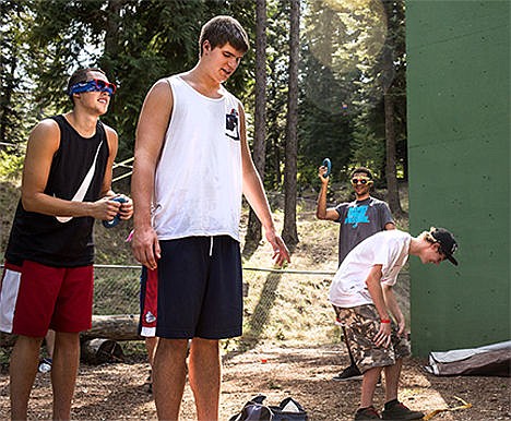 &lt;p&gt;From left to right, Gonzaga University basketball players Kyle Wiltjer, Ryan Edwards, and Bryan Alberts play a game of &quot;Silent Opera&quot; as Camp Gootimes camper Brysen Parker, center right laughs during the basketball team's visit to the camp on Monday at YMCA Camp Reed. The week-long camp is directed towards families affected by childhood cancer, and Gonzaga athletes have visited the camp every year.&lt;/p&gt;