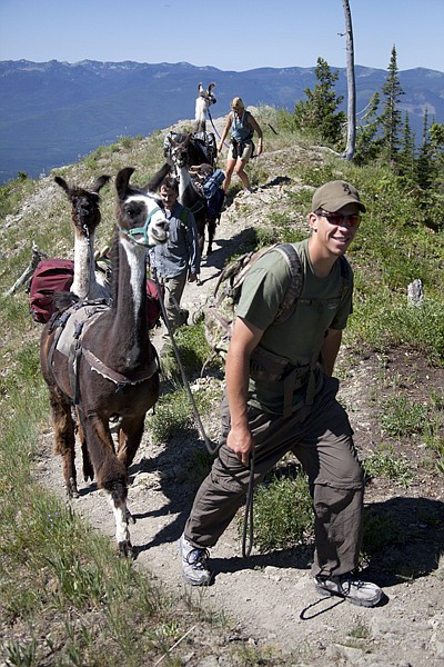 &lt;p&gt;Swan Mountain Outfitter guide Chris Schuler leads a group of hikers along a day hike with four llamas packed with lunch. A number of different llama treks are available through the Swan Mountain Outfitters.&lt;/p&gt;