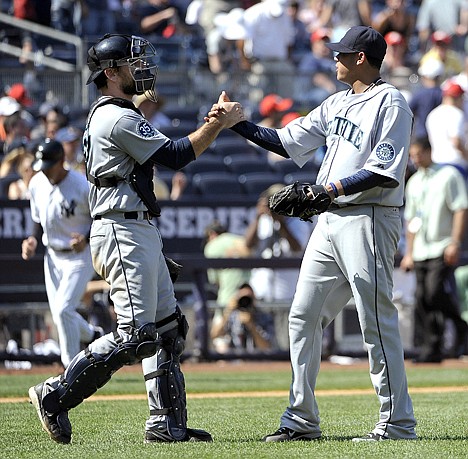 &lt;p&gt;Seattle catcher John Jaso, left, congratulates pitcher Felix Hernandez after the visiting Mariners beat the New York Yankees 1-0 on Saturday.&lt;/p&gt;