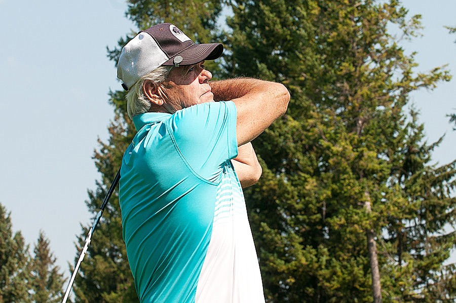 <p>Jerry Sonju watches his tee shot off Hole 16 Tuesday morning during the opening day of the Montana State Senior golf tournament at Buffalo Hill Golf Club. (Patrick Cote/Daily Inter Lake)</p>