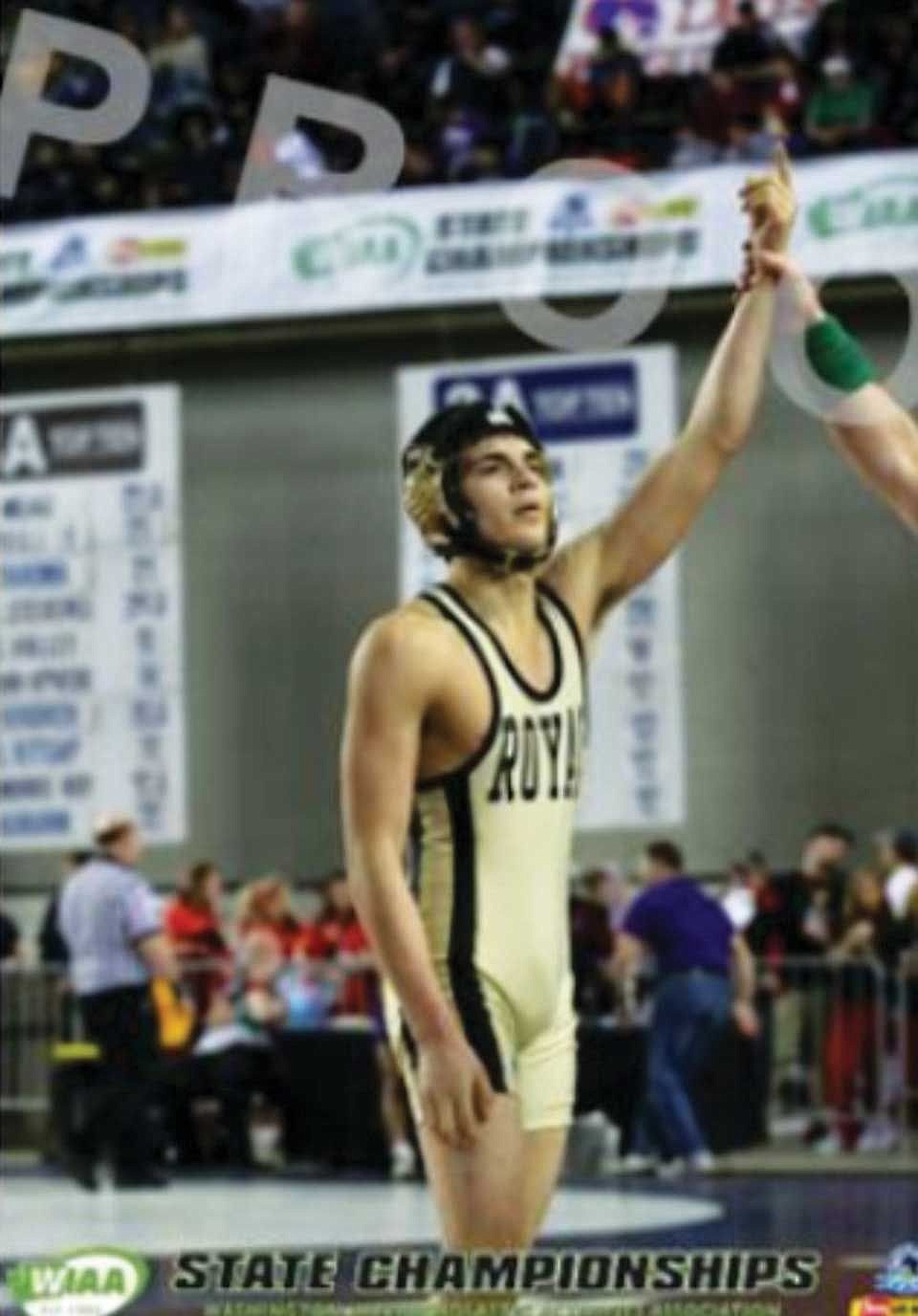 Danny Barajas at the moment his arm is raised as a state wrestling champ.