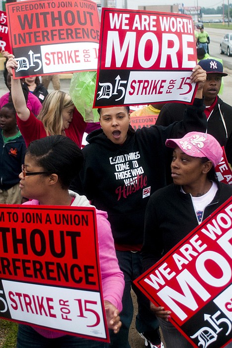 &lt;p&gt;Fast-food workers demonstrate in front of Church's Chicken July 31 in Flint, Mich.&lt;/p&gt;