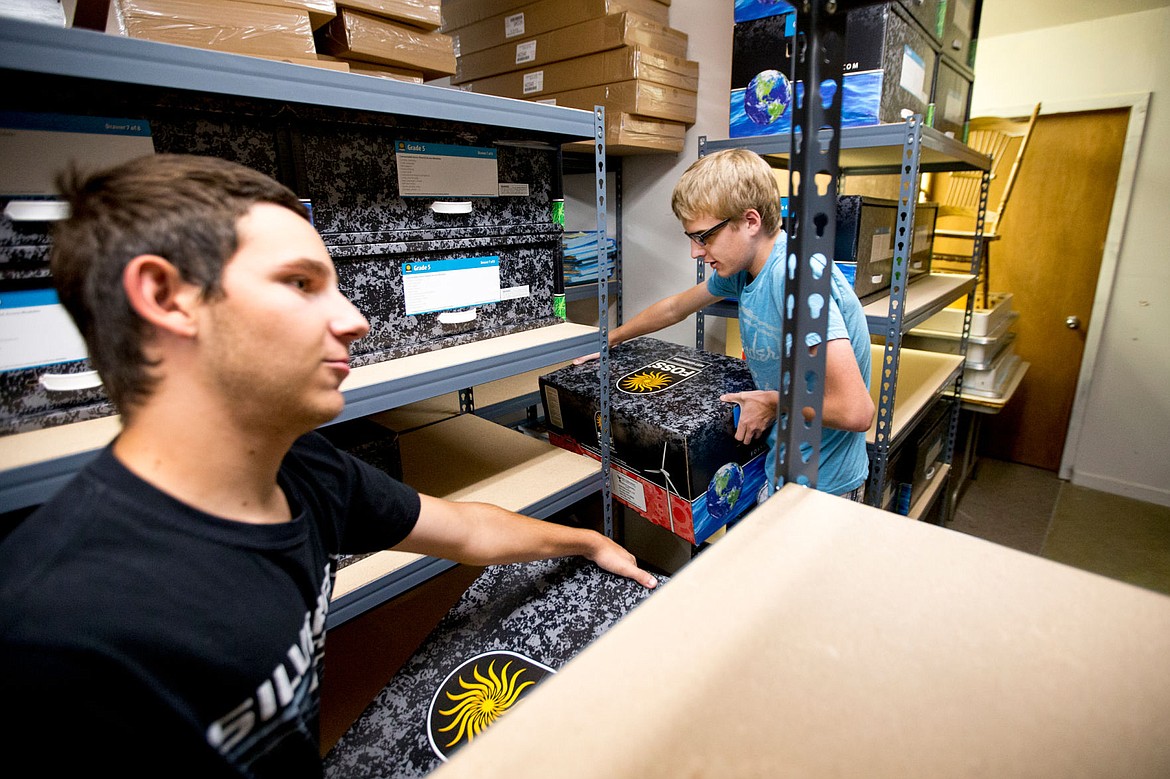 &lt;p&gt;As part of the TESH Summer Youth Employment Program, Patrick Bronson and Ryan Keller, both 17, organize boxes on Thursday full of educational science materials to be used in the upcoming school year.&lt;/p&gt;