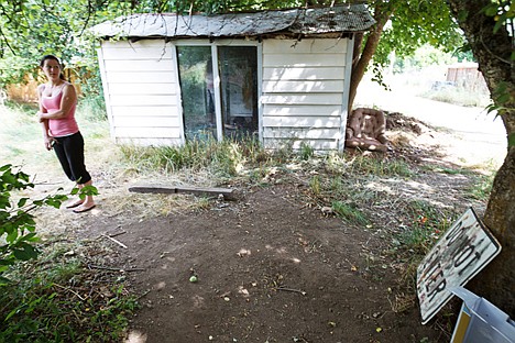 &lt;p&gt;Danielle Howell, of Coeur d'Alene, pauses after surveying the area where a sleeping registered sex offender was allegedly startled by her 12-year-old daughter near a play area that neighborhood children use.&lt;/p&gt;