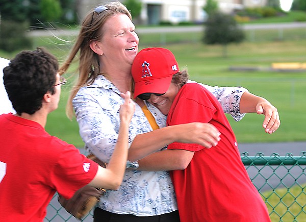 &lt;p&gt;Shirley Willis, executive director of Lighthouse Christian Home,
center, gets a hug from Jamey Herron, right, after she successfully
makes it around the bases on Wednesday, July 13, at Miracle Field
in the Kidsports Complex in Kalispell.&lt;/p&gt;