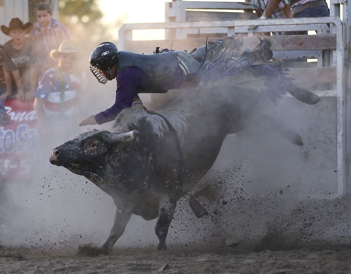 &lt;p&gt;Austin Reynolds of Ronan competes in bull riding at the rodeo in Ronan on Friday.&lt;/p&gt;