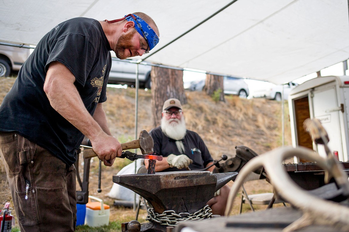 &lt;p&gt;David Kailey of Morgan Jade Ironworks forges the legs of a decorative iron bowl during a live blacksmith presentation on Friday at Art on the Green at North Idaho College.&lt;/p&gt;