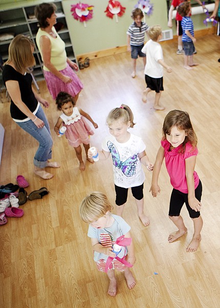 &lt;p&gt;Students of Woodland Montessori School dance along as they watch
a salsa dancing video Tuesday morning.&lt;/p&gt;