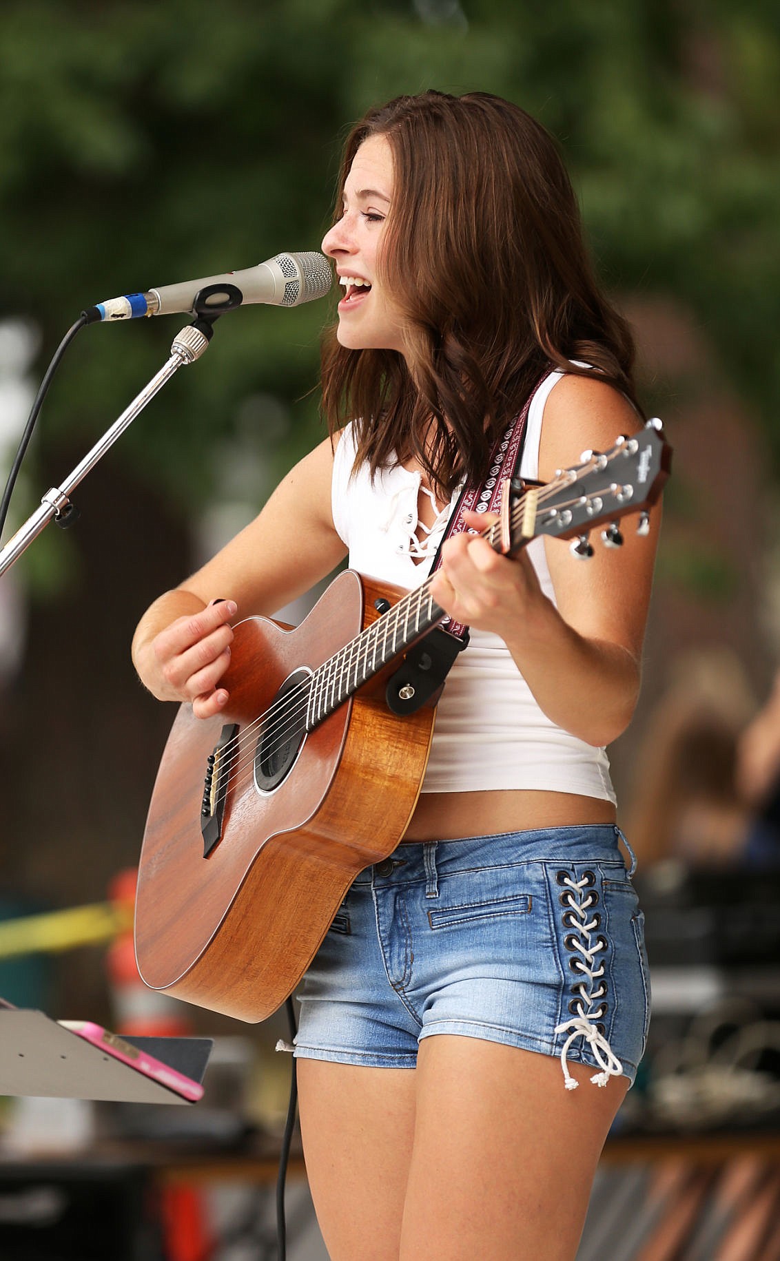 &lt;p&gt;Carli Osika, a recent Lake City High graduate, plays a variety of pop, country and classic covers during this year's Art on the Green at North Idaho College on Friday.&lt;/p&gt;