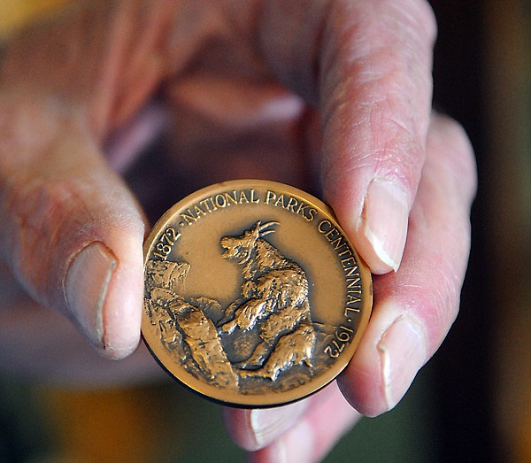 &lt;p&gt;Ed Rothfuss displays a comemorative coin in his for sale
collection on Monday, July 25 in Creston.&lt;/p&gt;