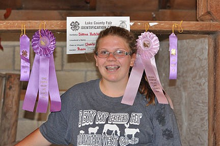 &lt;p&gt;Sierra Hutchin sits amidst her Grand and Reserve Champion ribbons that she won with her sheep.&lt;/p&gt;