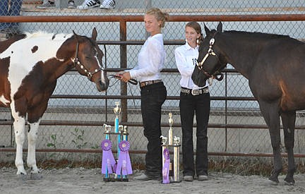 &lt;p&gt;Devi Knutson and Brooklyn Foust pose with their horses after Devi won the Sr. Grand Champion Overall Showman and Brooklyn won the Jr. Grand Champion Showman.&lt;/p&gt;