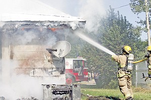 &lt;p&gt;LVFD firefighter Brady Fiscus sends a stream of water onto the house fire at 311 Idaho Sunday morning.&lt;/p&gt;