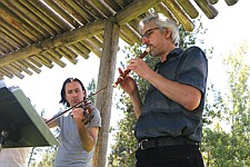 Artistic Director Adam LaMotte and Matthias Maute perform at the People's Center's music cultural exchange Wednesday in Pablo.