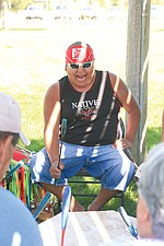 Polson's Louie Pierre plays with the drum group Native Heart at the People's Center's music cultural exchange Wednesday. Native drumming, dancing and Baroque music came together at the event.