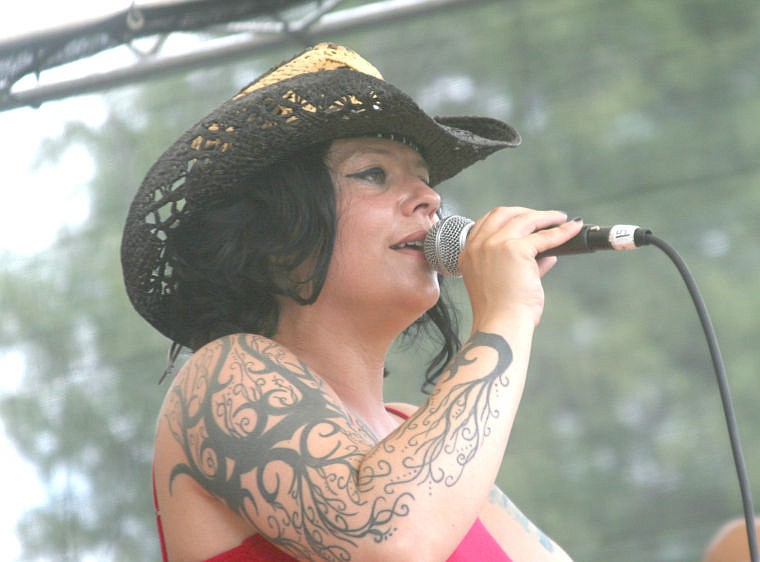 &lt;p&gt;Michelle Taylor takes the microphone as she plays with her band the Blues Junkies. The band came to the Blues Festival from Seattle.&lt;/p&gt;