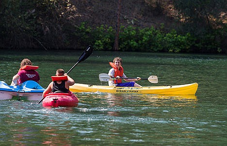 &lt;p&gt;Coeur d'Alene resident Austin Dunbar, 14, paddles a kayak with other campers during a boating activity at Camp Journey. Dunbar is a sibling of child leukemia survivor.&lt;/p&gt;
