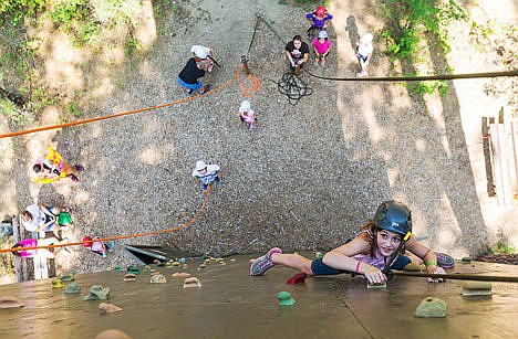 &lt;p&gt;Anna Cumbie focuses on her goal while scaling a climbing wall at the camp.&lt;/p&gt;
