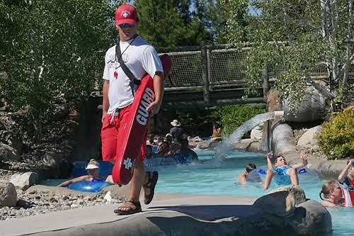 Landon Moulding, a Silverwood lifeguard, vigilantly watches over people floating the Lazy River.