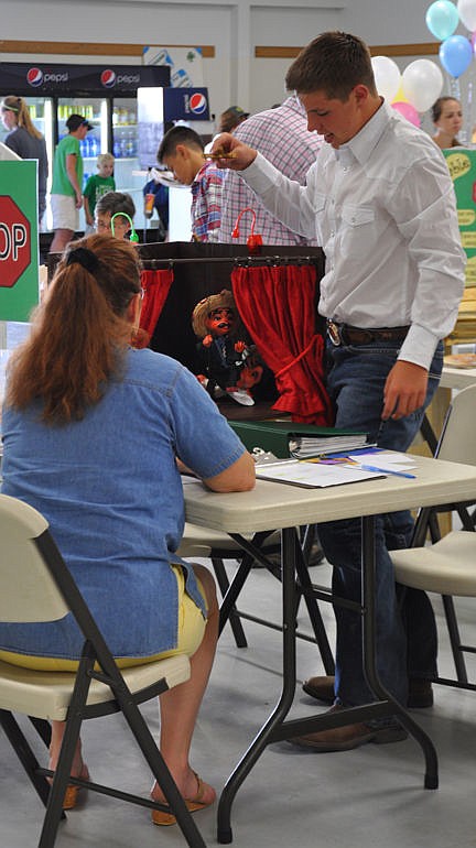 &lt;p&gt;Ty Kelsch demonstrates his puppeteering in the puppet stage he built for his Theater Arts project.&lt;/p&gt;