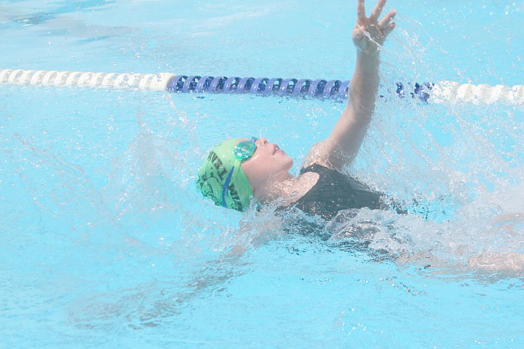 &lt;p&gt;Genevieve Deschamps swims the backstroke during a meet in Plains. The Plains home meet earlier in the season was the first opportunity for some swimmers to race the competition.&lt;/p&gt;